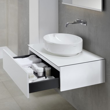 VariForm ellipse lay-on washbasin with bathroom furniture in white colour.