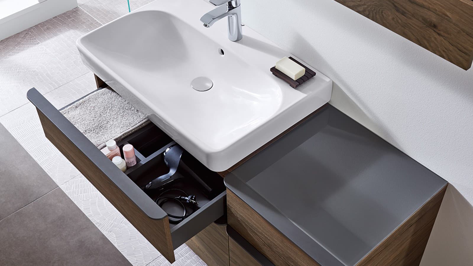 Geberit Smyle washbasin and furniture with opened drawer Geberit Smyle washbasin and furniture with opened drawer